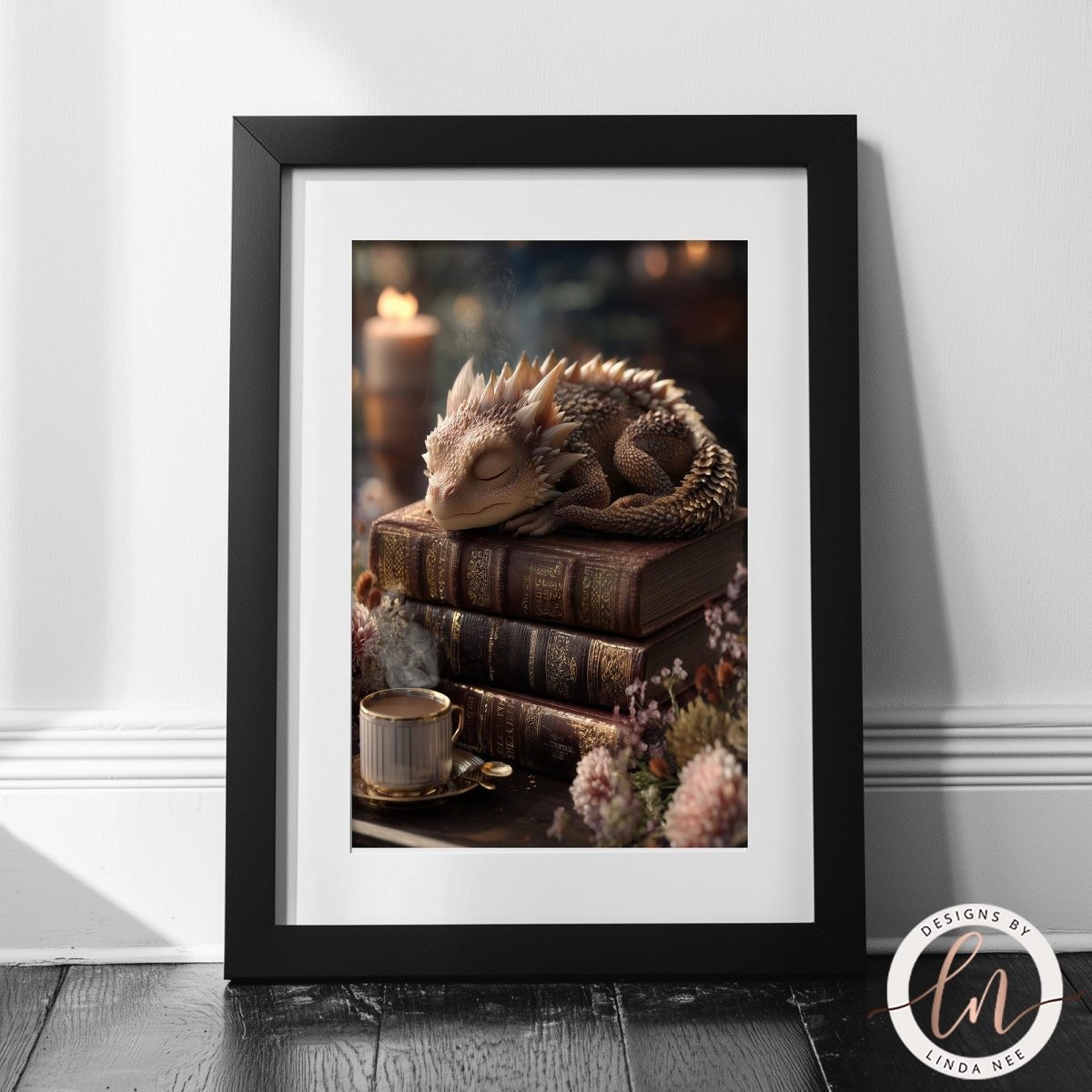 A framed image depicting a sleeping dragon resting on a stack of books, with a cup of tea nearby.