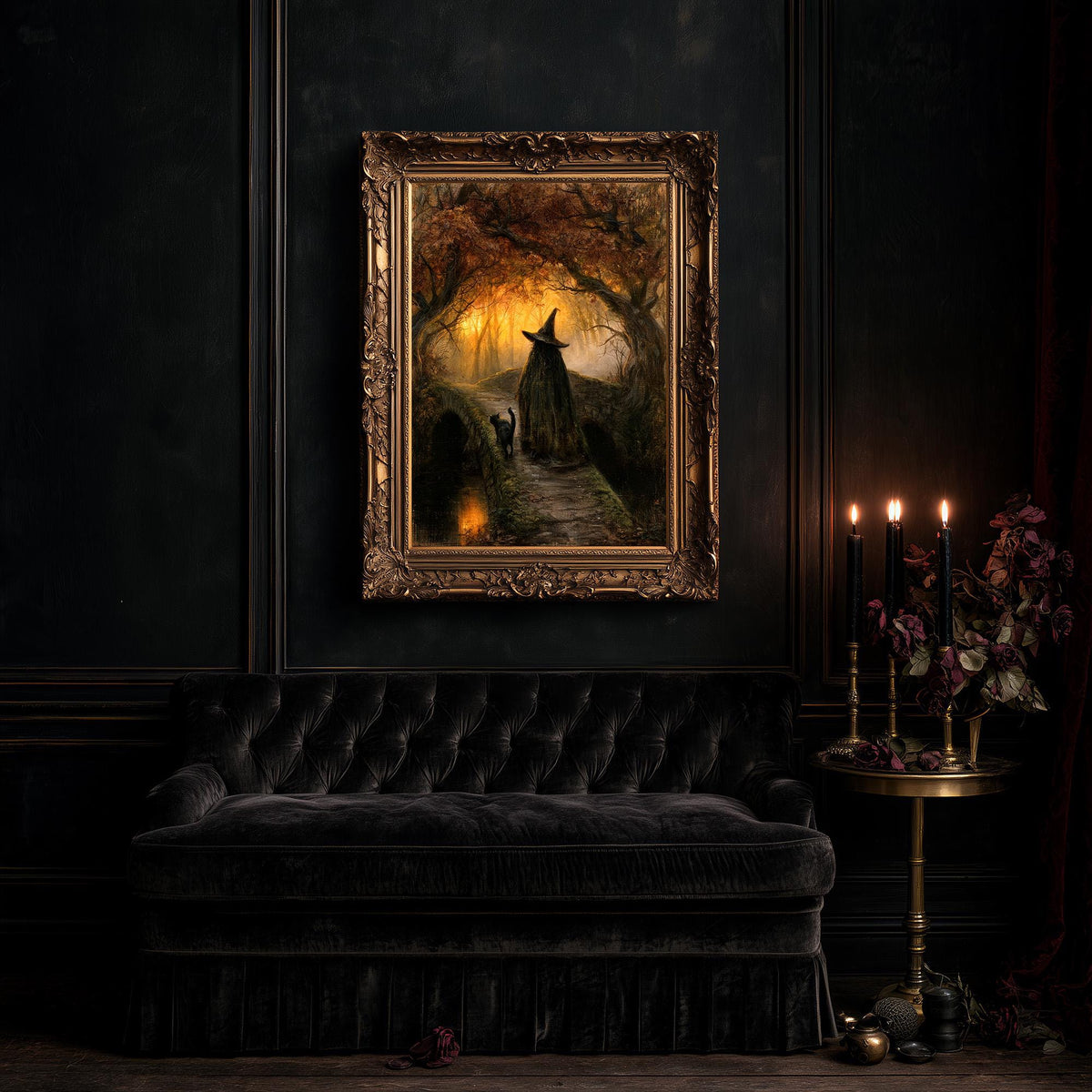 Large gothic wall art above a black tufted sofa in a dark, candlelit living room