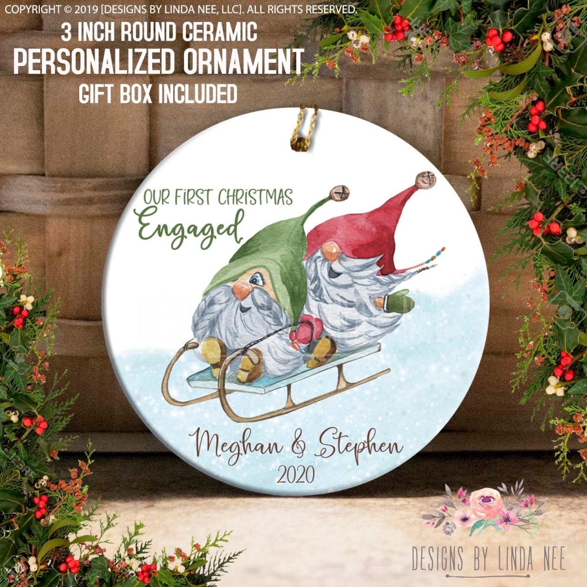 a ceramic ornament with a gnome and a sled, surrounded by holiday decorations such as berries and greenery. The ornament is personalized with the names "Megan & Stephen" and the year "2020".