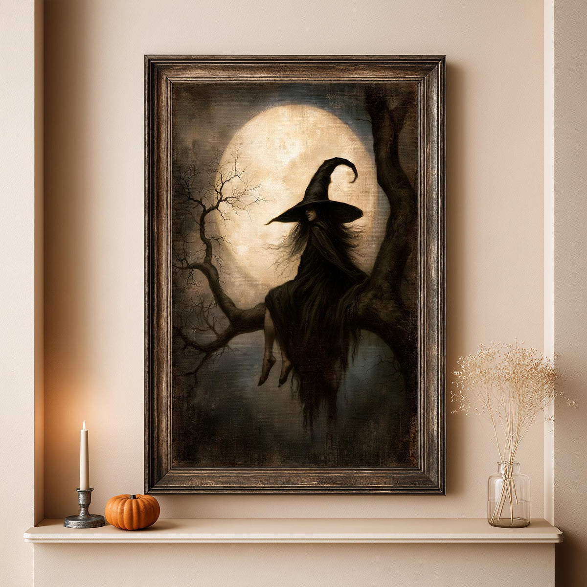 Oversized moonlit witch print above a shelf with a candle and a small pumpkin
