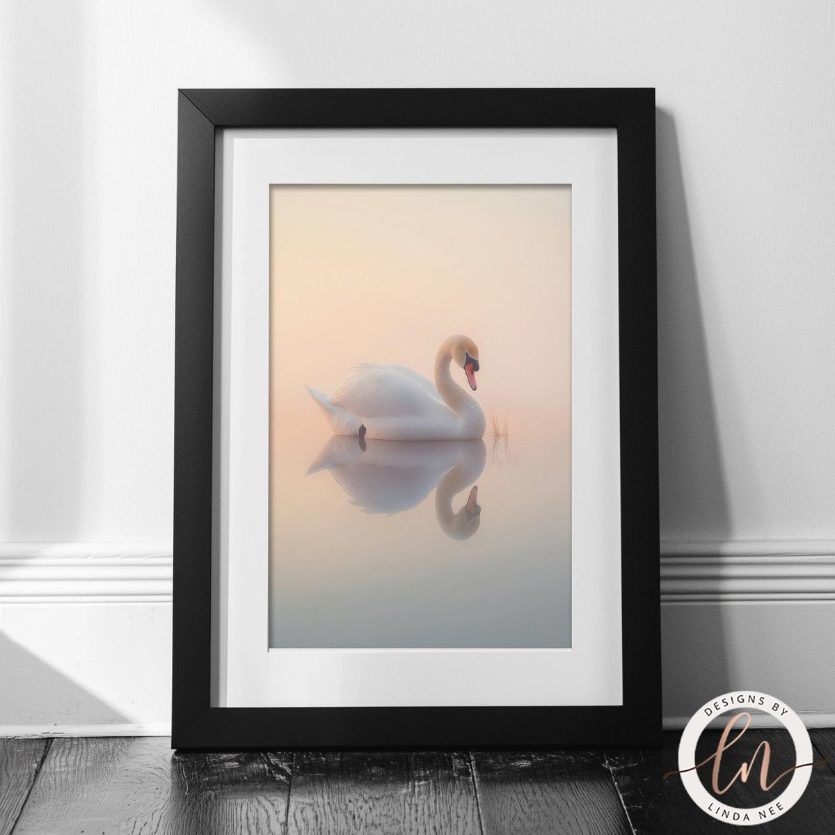 A framed image of a white swan floating on a calm body of water, with a warm, hazy background.