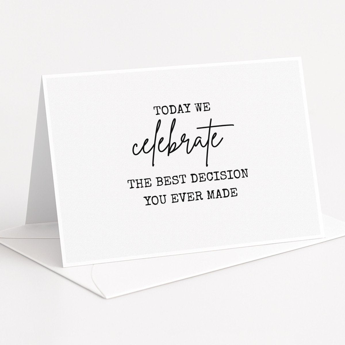 a white card with black text that reads "Today we celebrate the best decision you ever made".