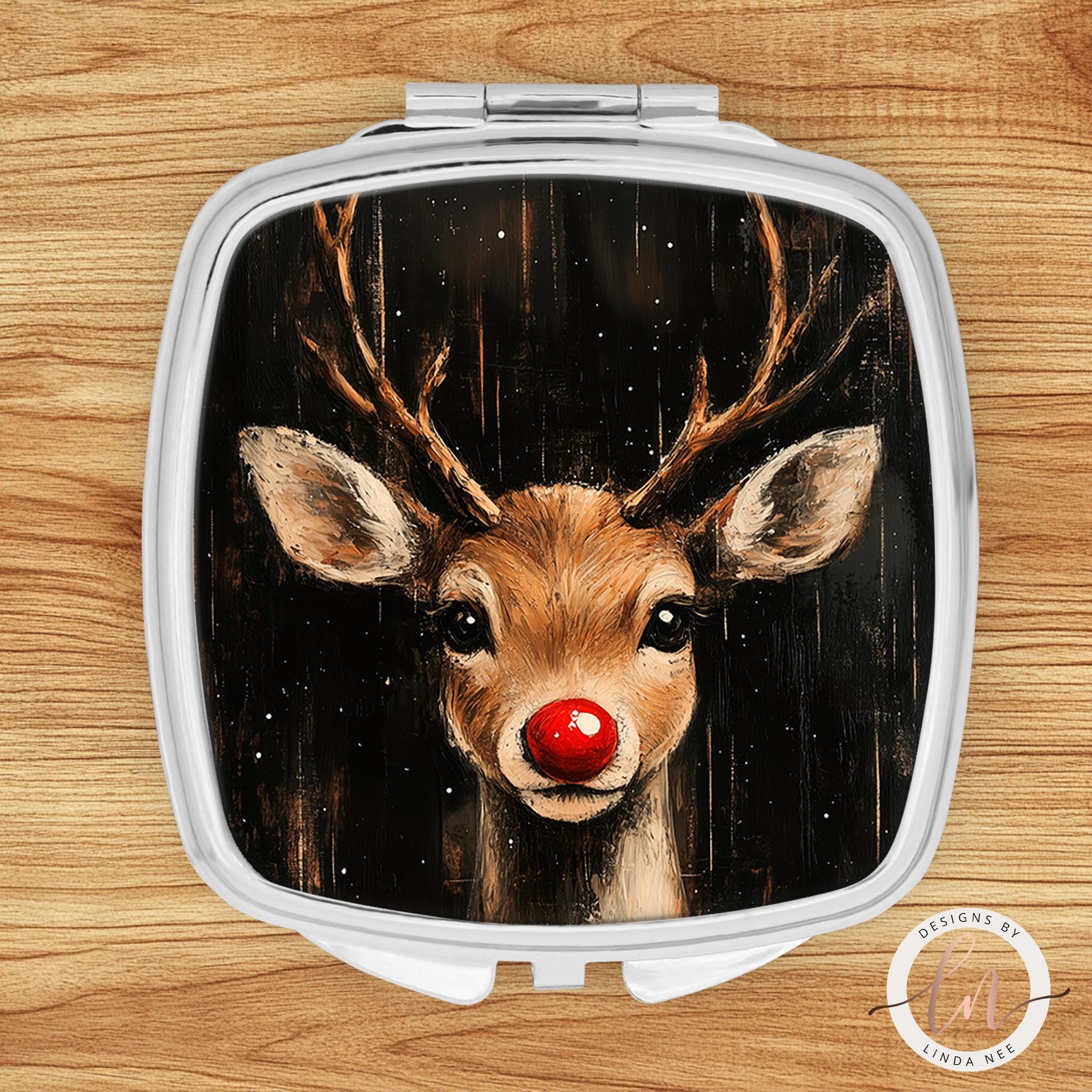 a mirror with a picture of a deer with a red nose