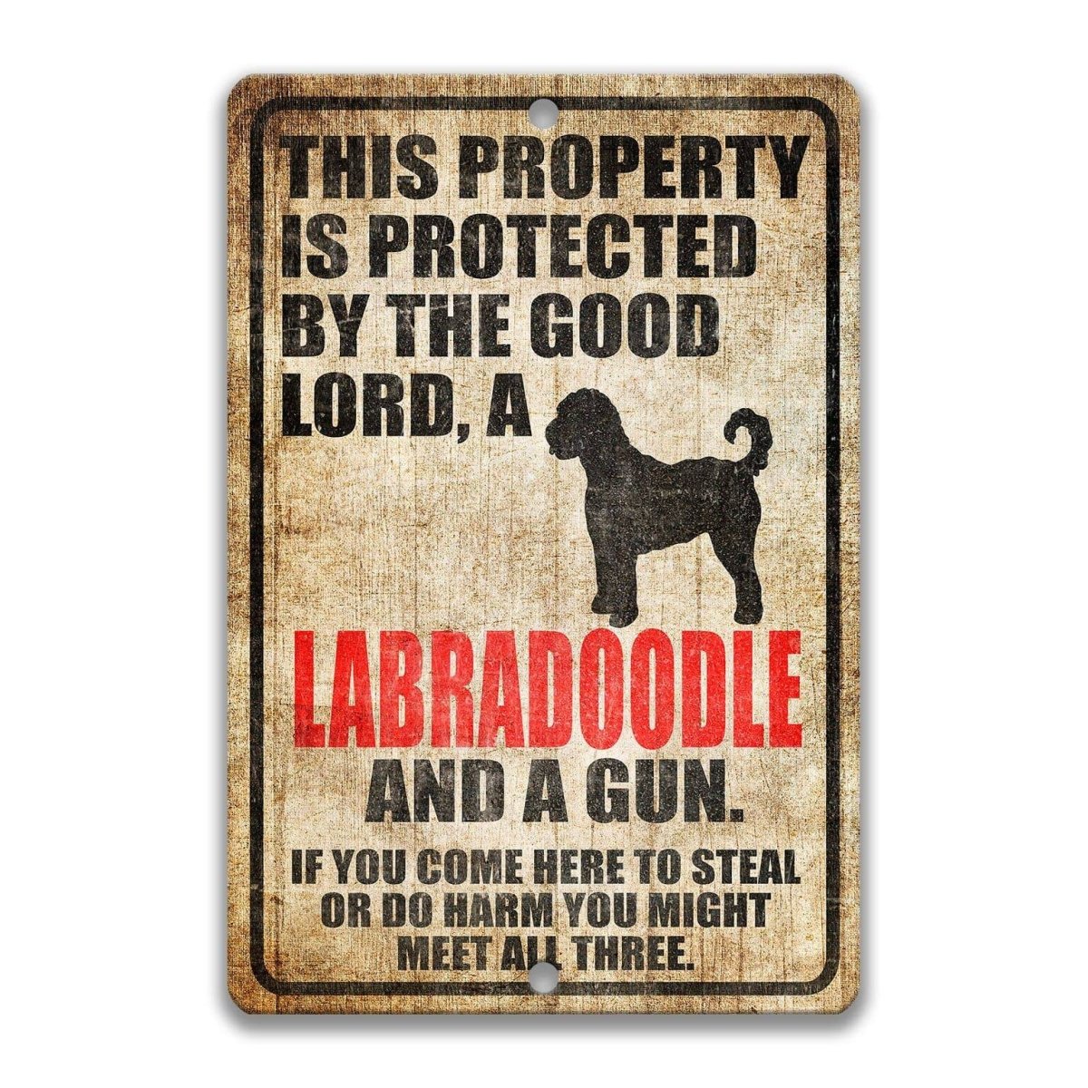 The image is a sign that reads "This property is protected by the good Lord, a Labradoodle and a gun. If you come here to steal or do harm, you might meet all three."