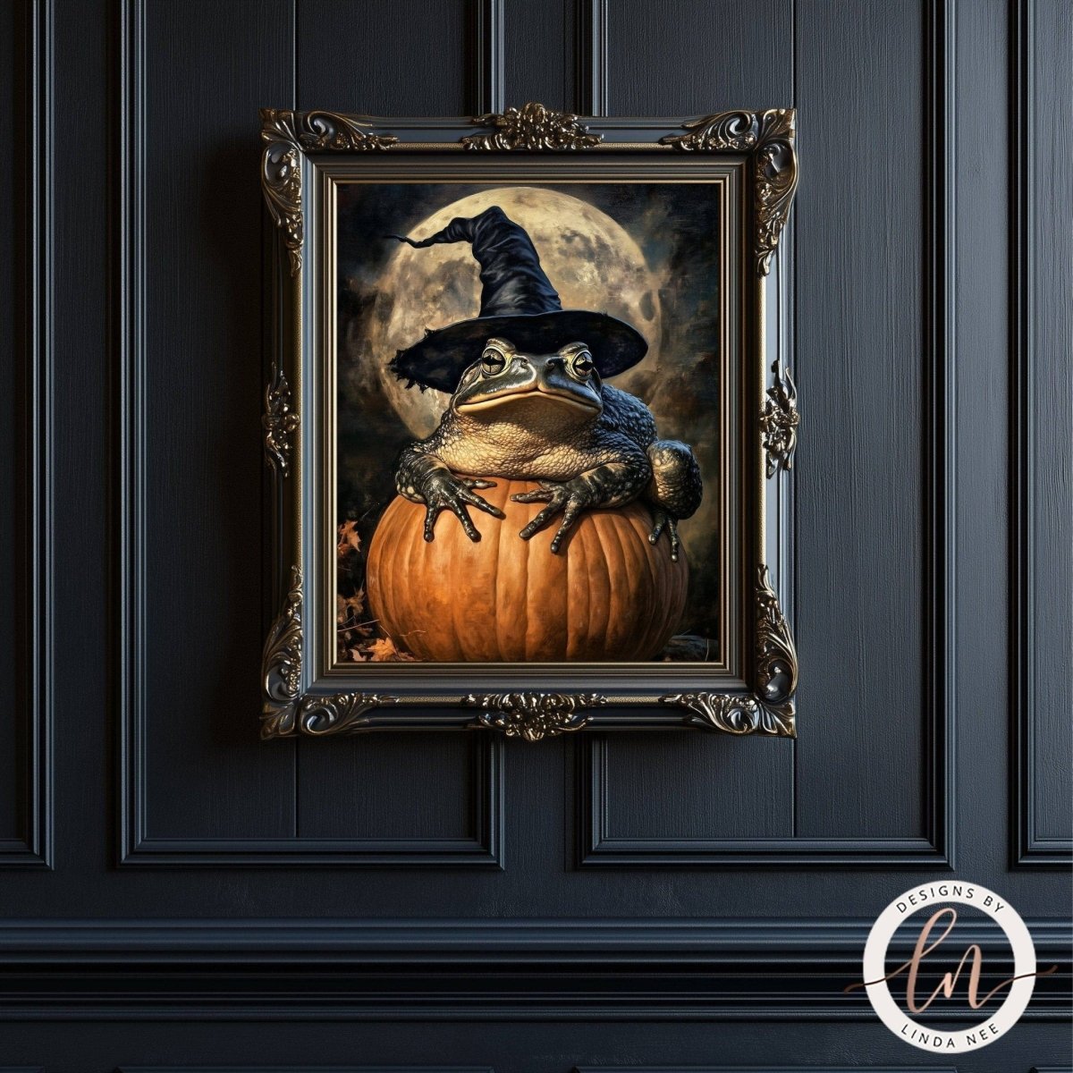 A framed image of a frog wearing a witch's hat and sitting on a pumpkin, set against a dark background with a full moon.