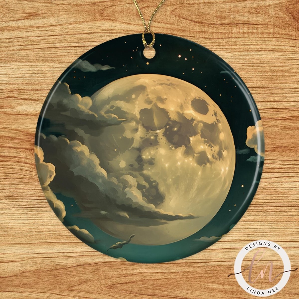 A circular ornament with a large, detailed illustration of a moon surrounded by clouds and stars against a dark night sky.