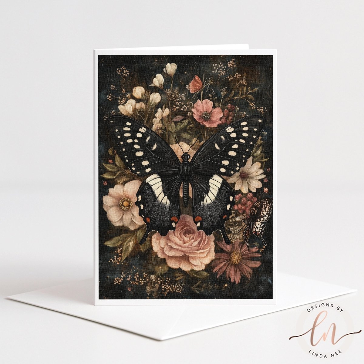 A black and white butterfly rests on a floral arrangement, surrounded by various flowers and leaves.