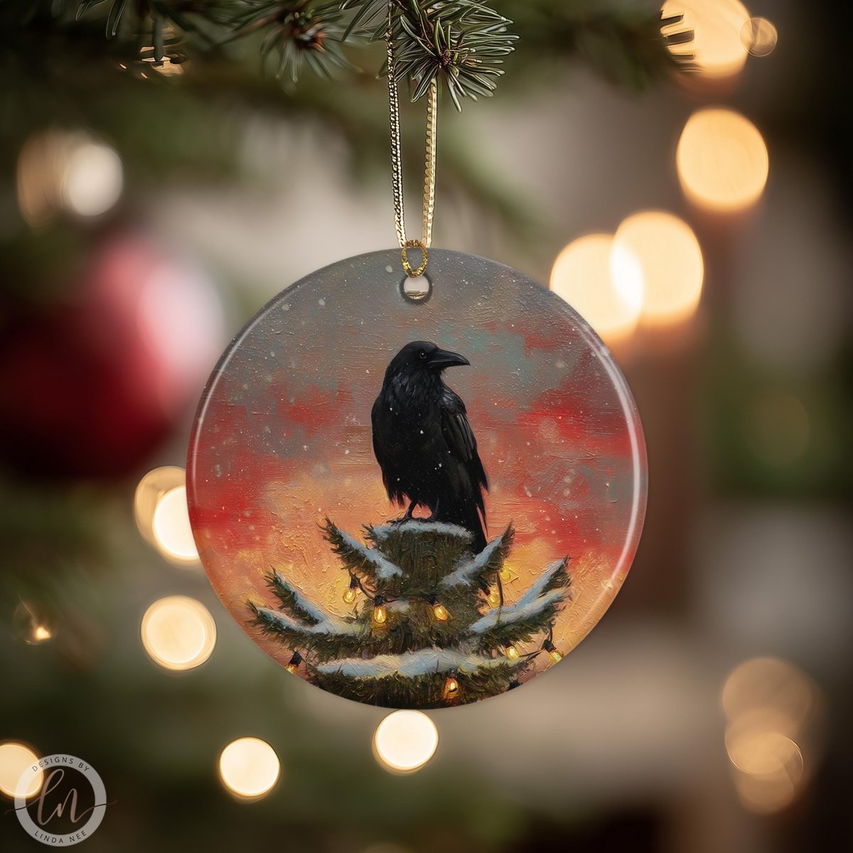 A black bird is perched on a snowy tree branch, with a red and orange sunset in the background.