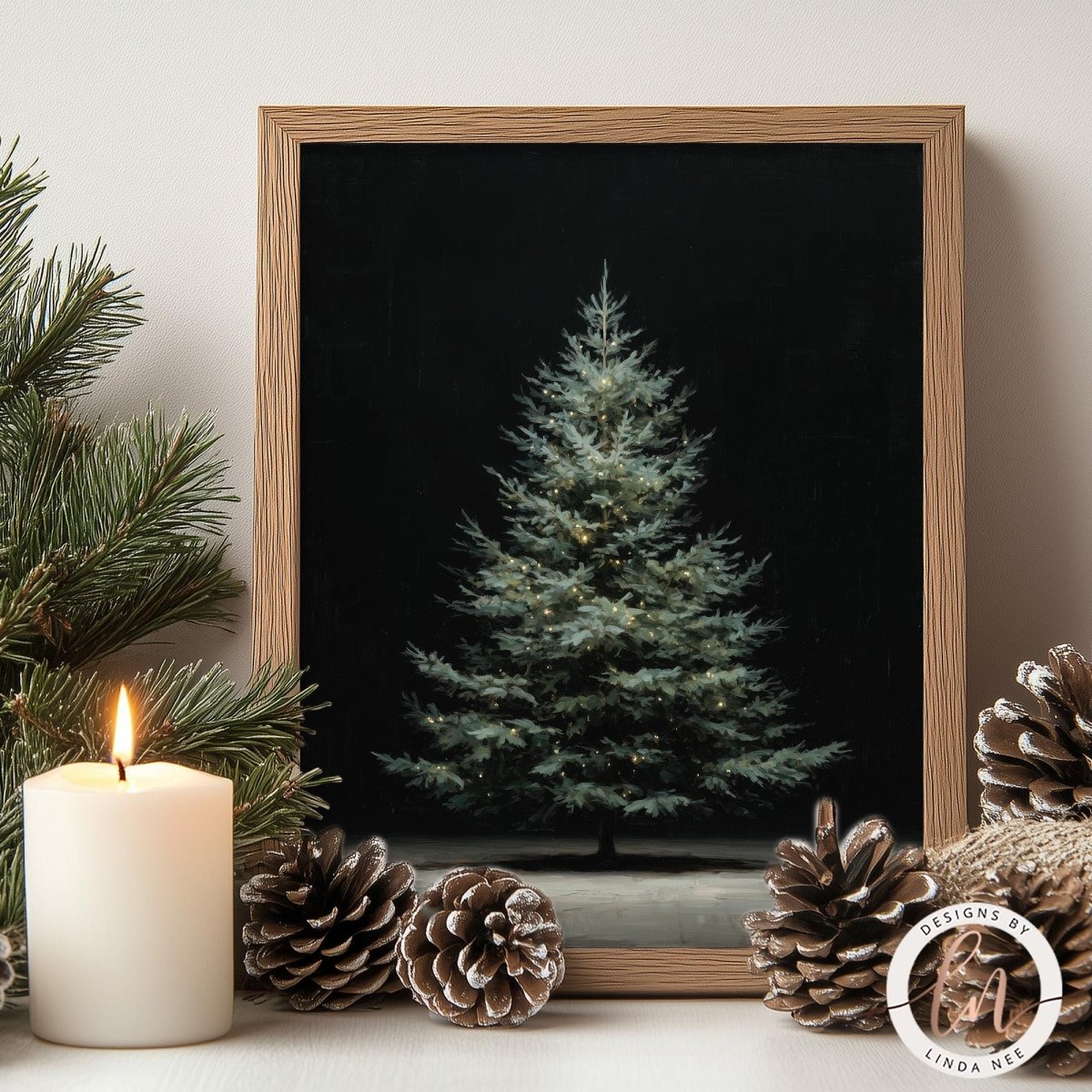 a lit candle, pine cones, and a framed picture of a Christmas tree, creating a cozy and festive atmosphere.