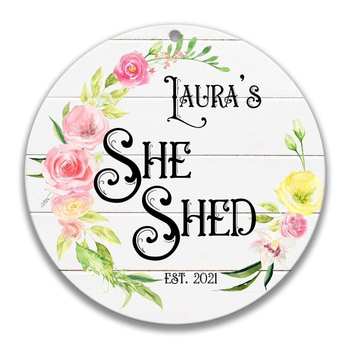 A round sign with a floral design and text.