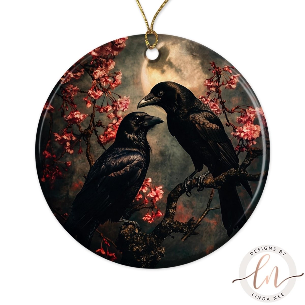 two black birds perched on a branch with pink flowers.