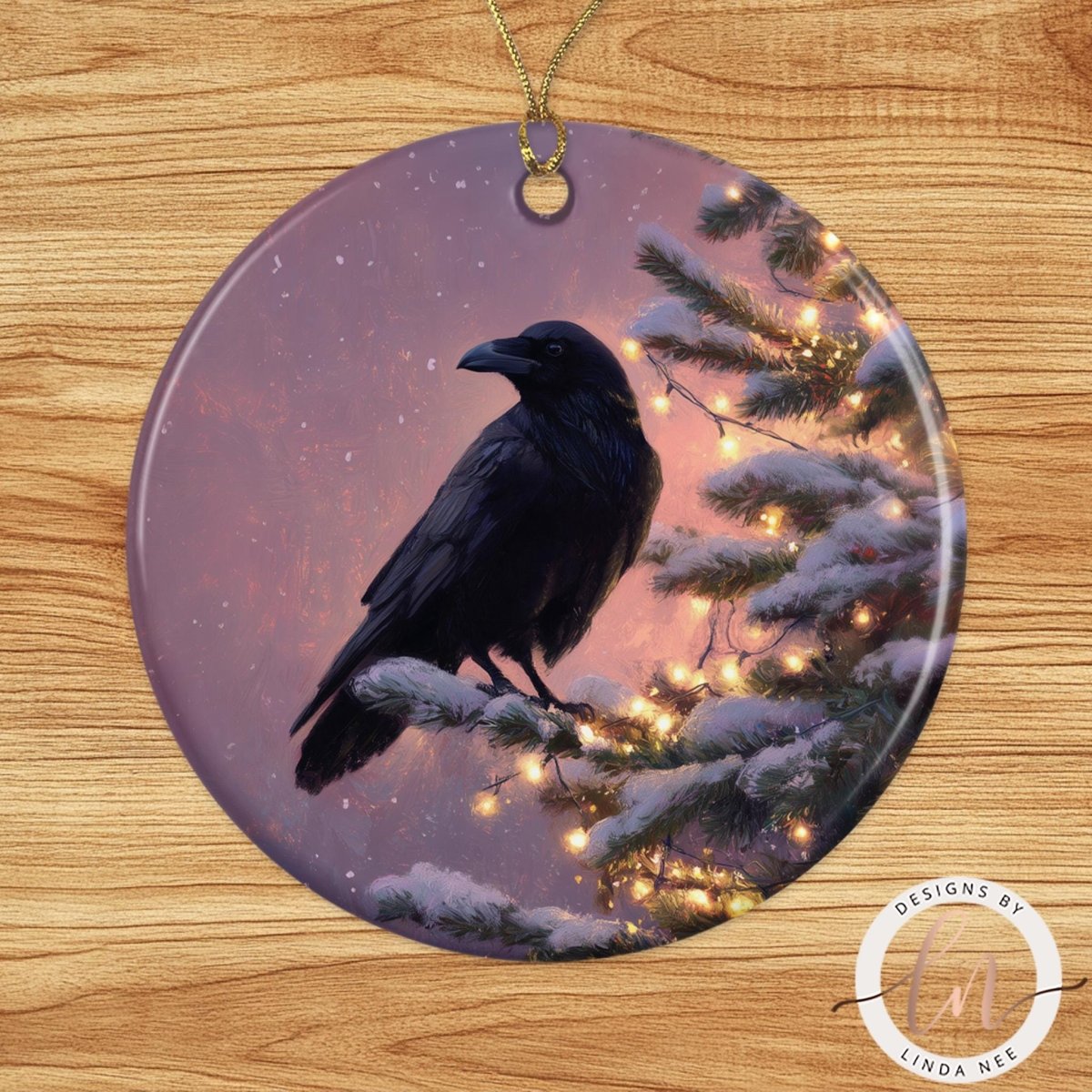 A black crow perched on a snowy branch, with a twinkling Christmas tree in the background.