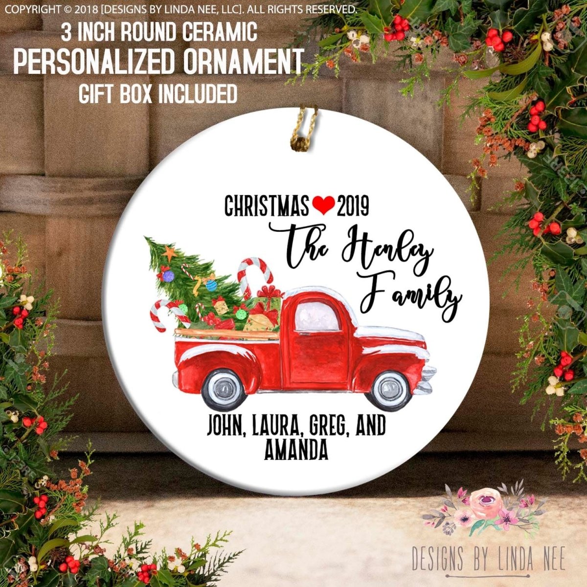 a round ceramic ornament with a Christmas tree and a red truck, along with text that reads "Christmas 2019 The Hanley Family John, Laura, Greg, and Amanda".