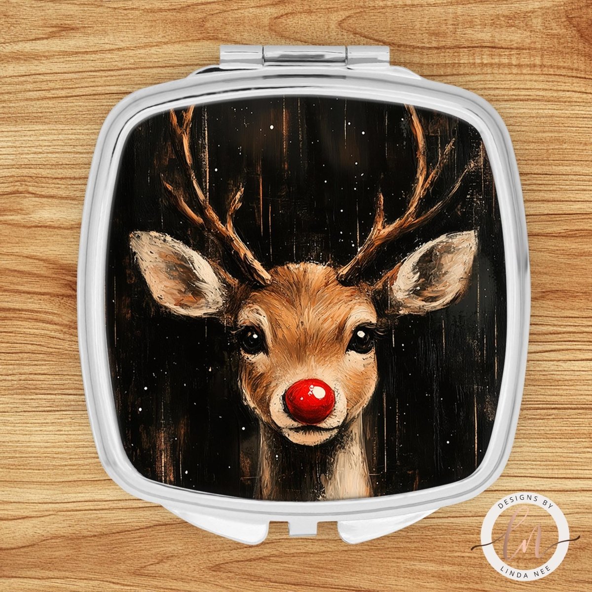 a mirror with a picture of a deer with a red nose