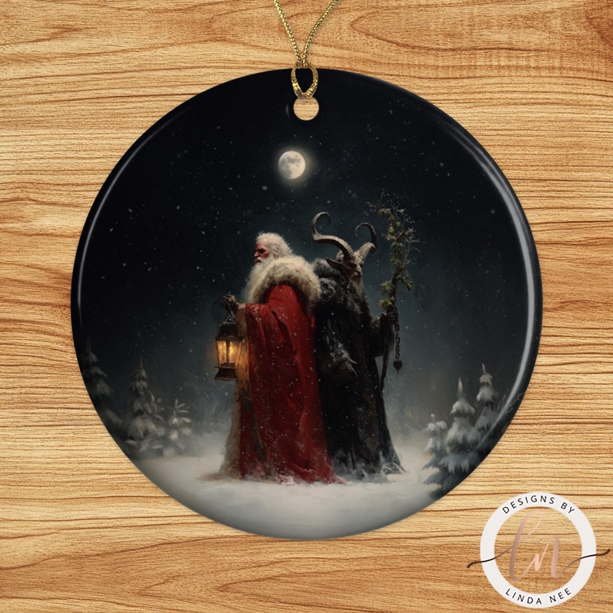 A Christmas ornament depicting a snowy night scene with Santa Claus and a dark figure, possibly a devil or witch, standing in the snow.