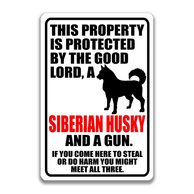 Lord, Siberian Husky and a Gun Sign