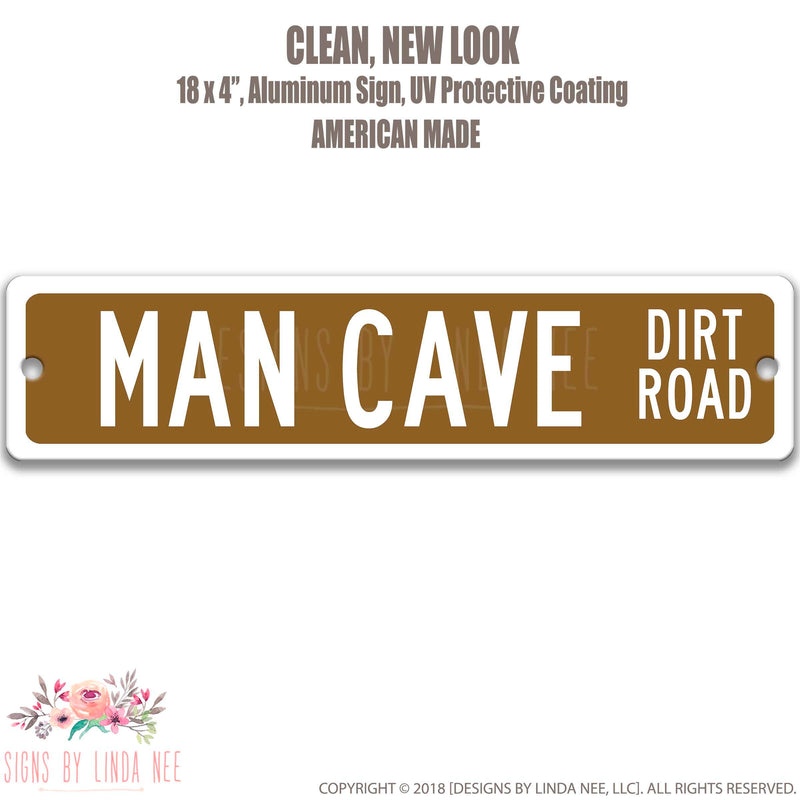 White text saying Man Cave Dirt Road on a brown background