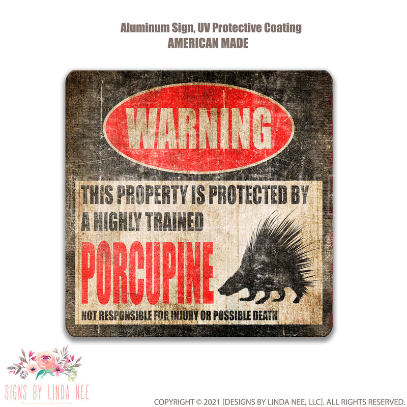 Distressed look background with font saying Warning This Property is Protected by a Highly trained Porcupine Not responsible for injury or possible death Square Sign