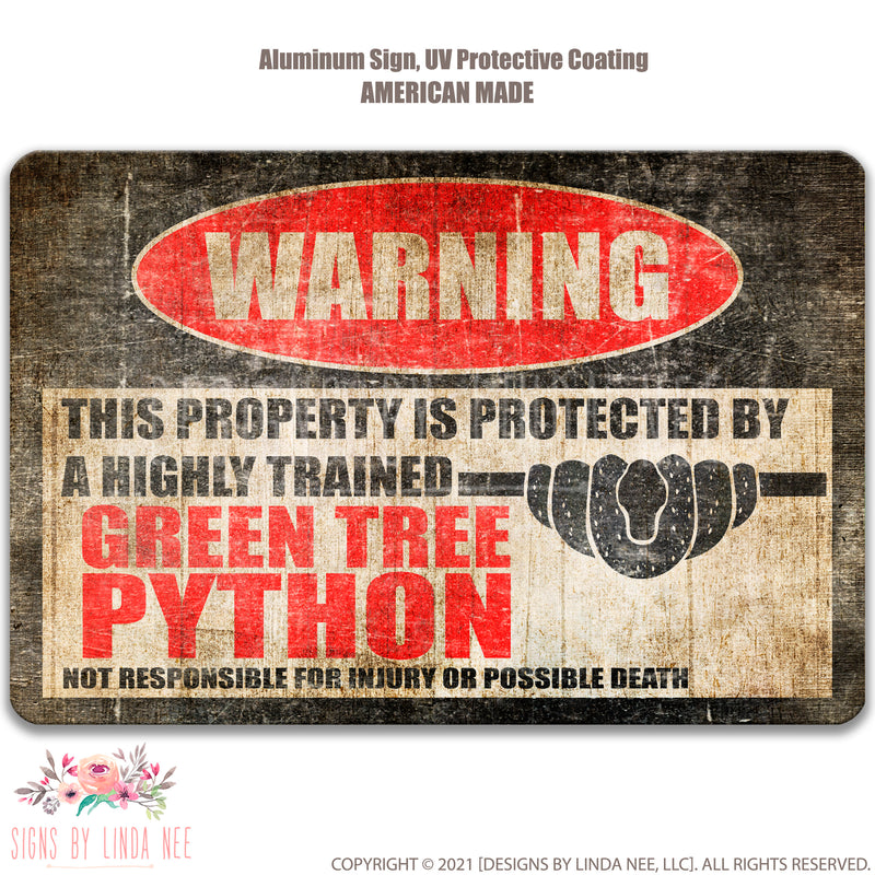 Distressed look background with font saying Warning This Property is Protected by a Highly trained Green Tree Python Not responsible for injury or possible death sign   