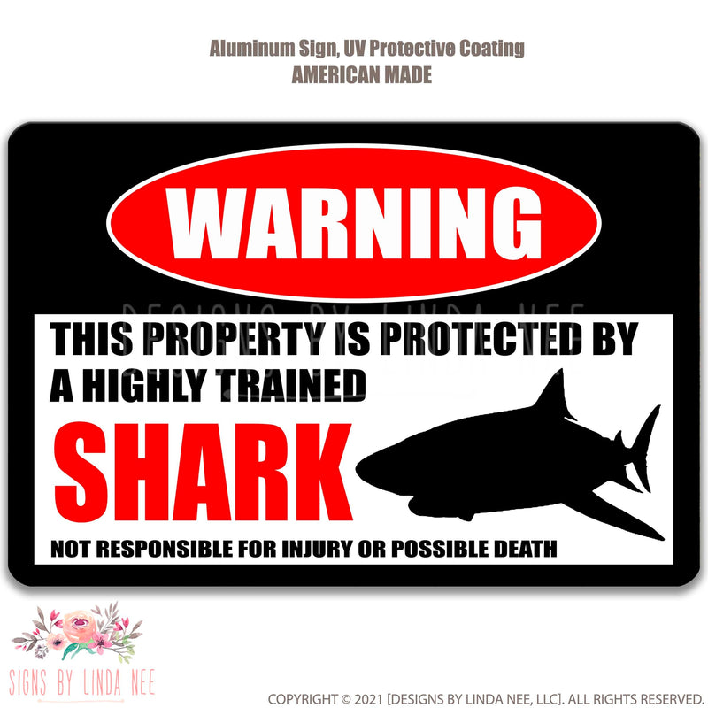 White background with font saying Warning This Property is Protected by a Highly trained Shark Not responsible for injury or possible death